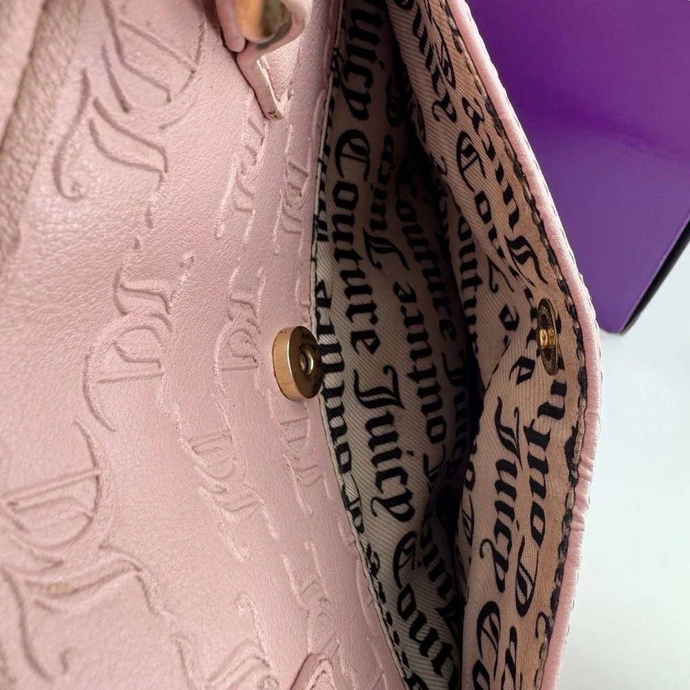 Y2K Juicy Couture satchel in pink, features an all-over embossed 